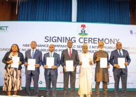L-R : Onyebuchim Obiyemi, Director & Head, Investment Banking, CardinalStone Partners Limited; Ayodeji Gbeleyi, Director-General, Bureau of Public Enterprises; Akin Odeyemi, MD/CEO, Nigerian Bulk Electricity Trading Plc (NBET); Taiwo Oyedele, Honourable Minister of Finance and Coordinating Minister of the Economy; Alhaji Mahmuda Mamman, Permanent Secretary, Ministry of Power; Lanre Babalola, Special Adviser to the President on Power and Michael Nzewi, Group Managing Director, CardinalStone Partners Limited, at the signing ceremony for the ₦728.97 billion Series 2 Power Sector Bond in Abuja. The transaction is aimed at addressing verified legacy obligations in the power sector and strengthening liquidity across the electricity value chain.