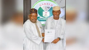 Registrar/CEO, NABTEB, Dr. Mohammed Aminu Mohammed and President, ITPN, Chief Abiodun Odusanwo, displaying the signed MoU document.